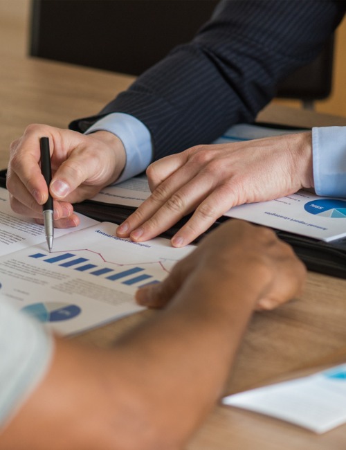 advisor showing financial brochure to client